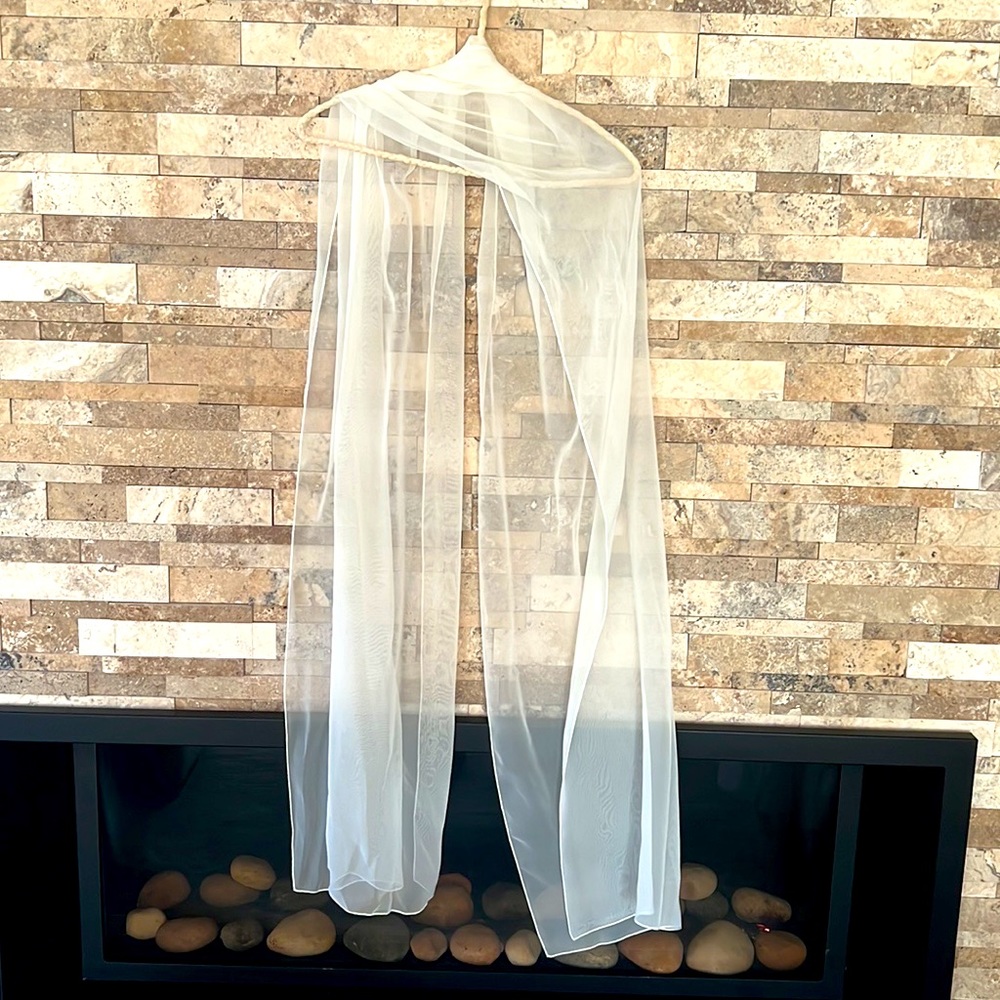 Hand custom made in Canada long over the shoulder sheer white shawl.